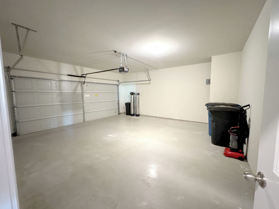 2 car garage with opener, water softener and an EV charger