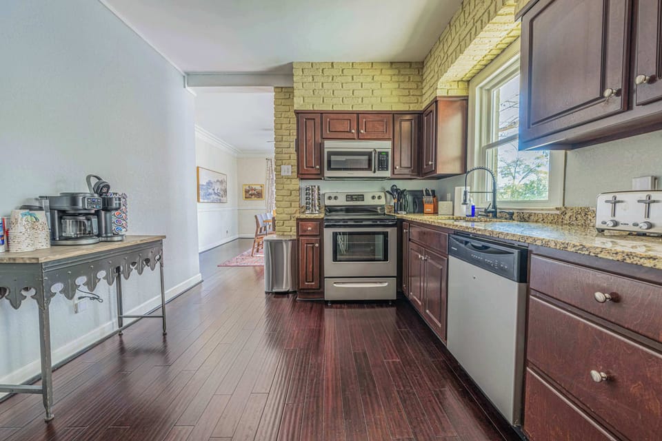 "Prepare delicious meals in this fully equipped kitchen. With modern appliances and ample counter space, it has everything you need to create culinary masterpieces."

