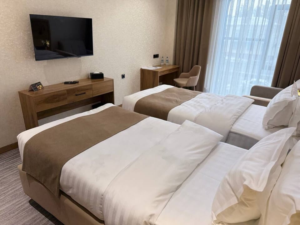 Minibar, iron/ironing board (on request), WiFi (free), bed sheets