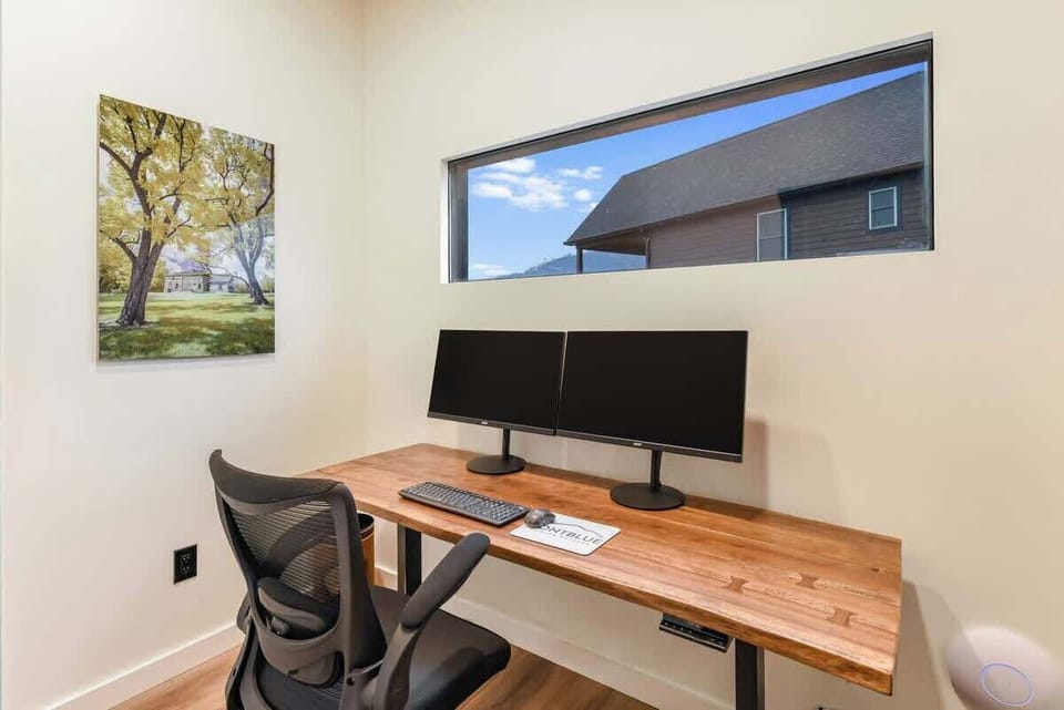 Dedicated workspace enclosed with dual monitors. 