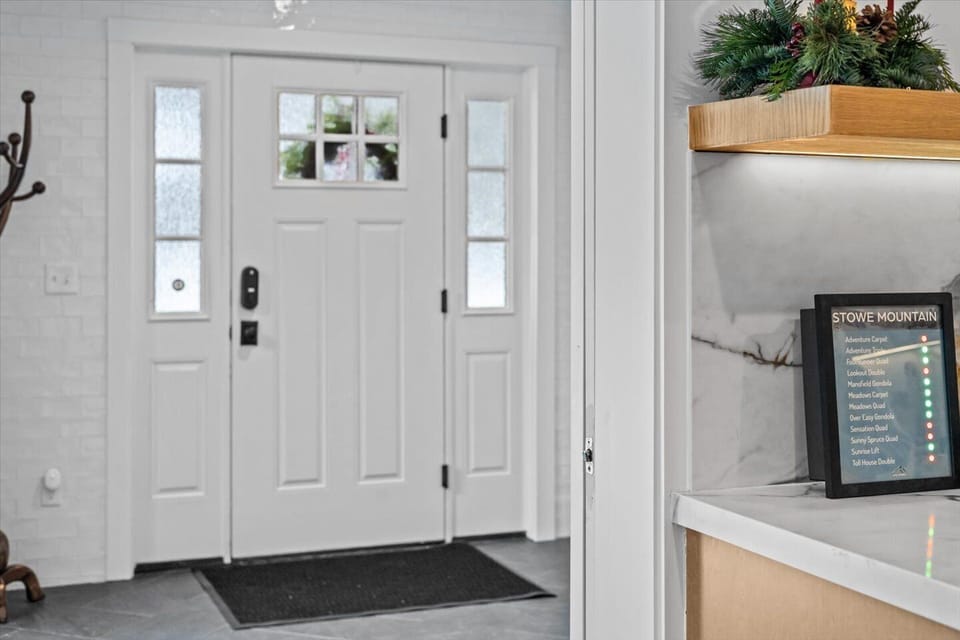 Our mudroom offers a ski rack, boot trays, bench storage, a coat rack and hooks and radiant floors to keep everything dry