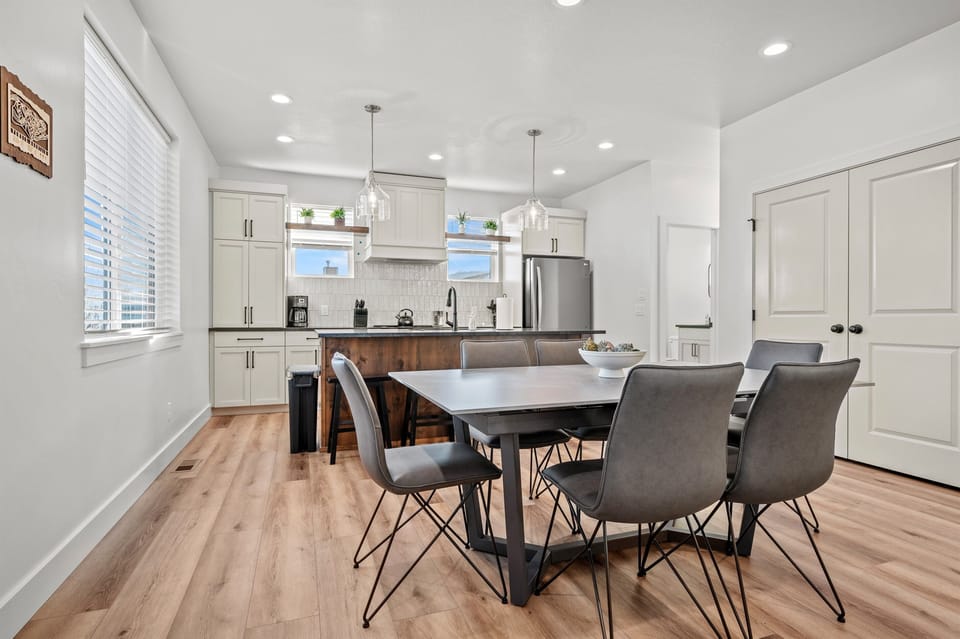 The dining table seats six, extends to 8, and there are four more chairs at the kitchen island. The pantry has two more chairs if needed.