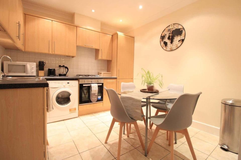 A stylish, fully equipped kitchen with an elegant dining area, thoughtfully designed to bring family and friends together over delicious home-cooked meals