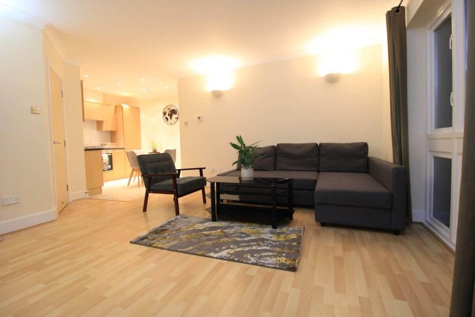 Spacious living room with a comfortable sofa bed, creating a versatile space for relaxing, entertaining or additional overnight guests