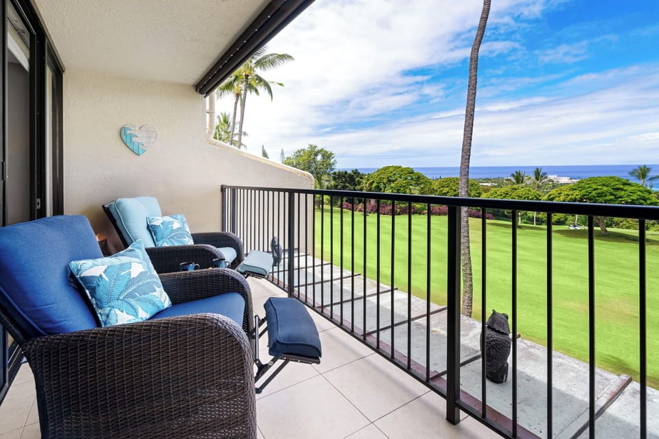 Covered lanai with a dining table, and lounge chairs
