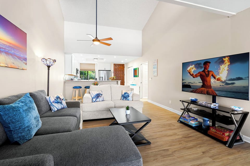 Enjoy the spaciousness of the open kitchen & living room with high ceilings & spectacular views of the ocean