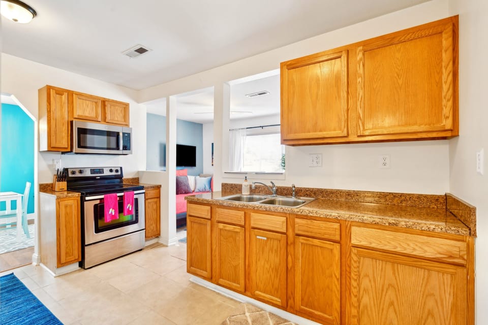 Kitchen centrally located between dining room and office/“nook”