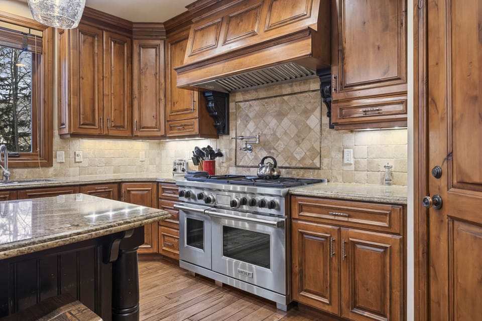 Kitchen: Drip coffee maker, Sub-Zero fridge, Wolf oven, cooking utensils
