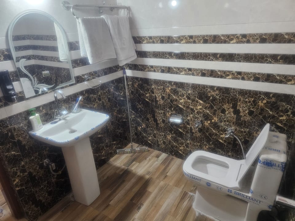 Classic Quadruple Room, Patio, River View | Bathroom | Shower, rainfall showerhead, free toiletries, towels