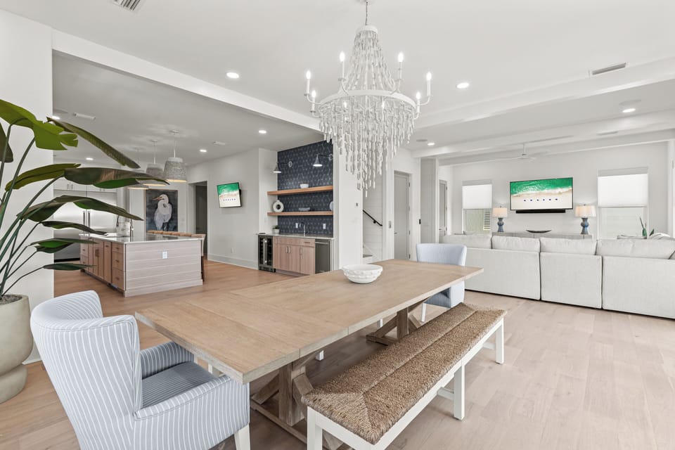Unwind in this bright, open living space where the crystal chandelier adds elegance to your memorable gatherings.