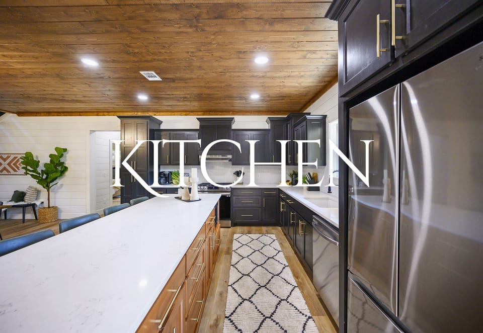 The spacious kitchen offers sleek design, high-end appliances, and plenty of counter space for cooking and entertaining.
