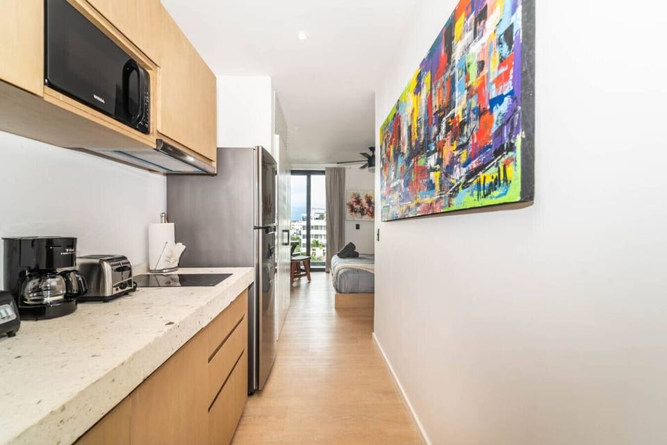 The kitchen is perfect for quick snacks or gourmet meals, offering a welcoming and functional space.