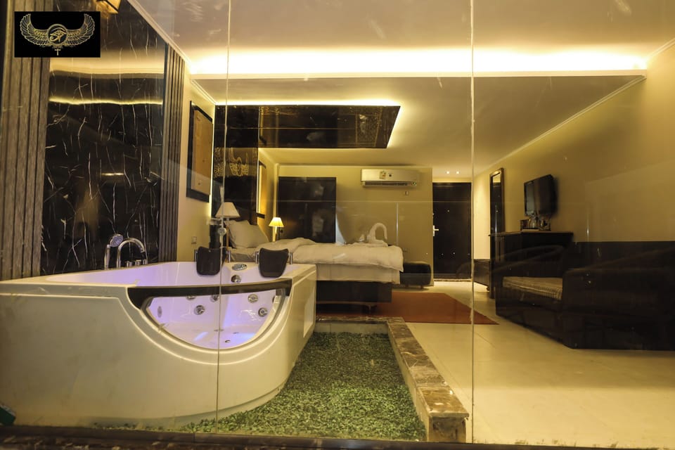 Deluxe Suite, Balcony | In-room safe, blackout drapes, iron/ironing board, free WiFi