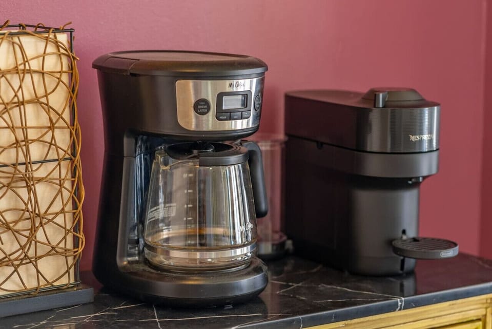 Start your day right with a stocked coffee bar—complete with Nespresso pods and a drip coffee maker.