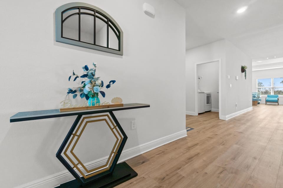 Step into your bright, modern space where elegant hardwood floors flow seamlessly from room to room, creating an open, airy atmosphere.