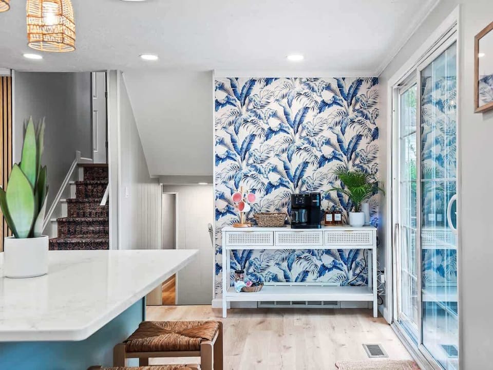 Kitchen details w/ sleek counters, modern fixtures & functional layout