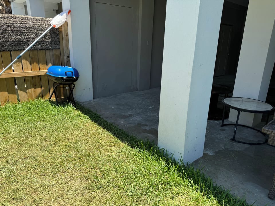 Rear patio with charcoal grilled and to spend time relaxing 