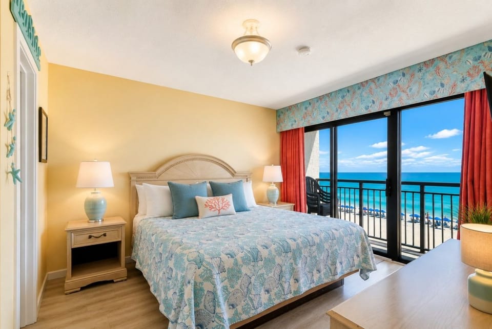 Wake up in the gorgeous main bedroom with a king bed, private bathroom, and direct oceanfront balcony access.