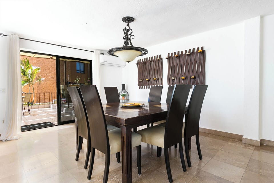 A stylish and spacious dining area with seating for eight, perfect for family meals or entertaining guests. Designed for both comfort and elegance, this inviting space is ideal for gathering and creating memorable moments.