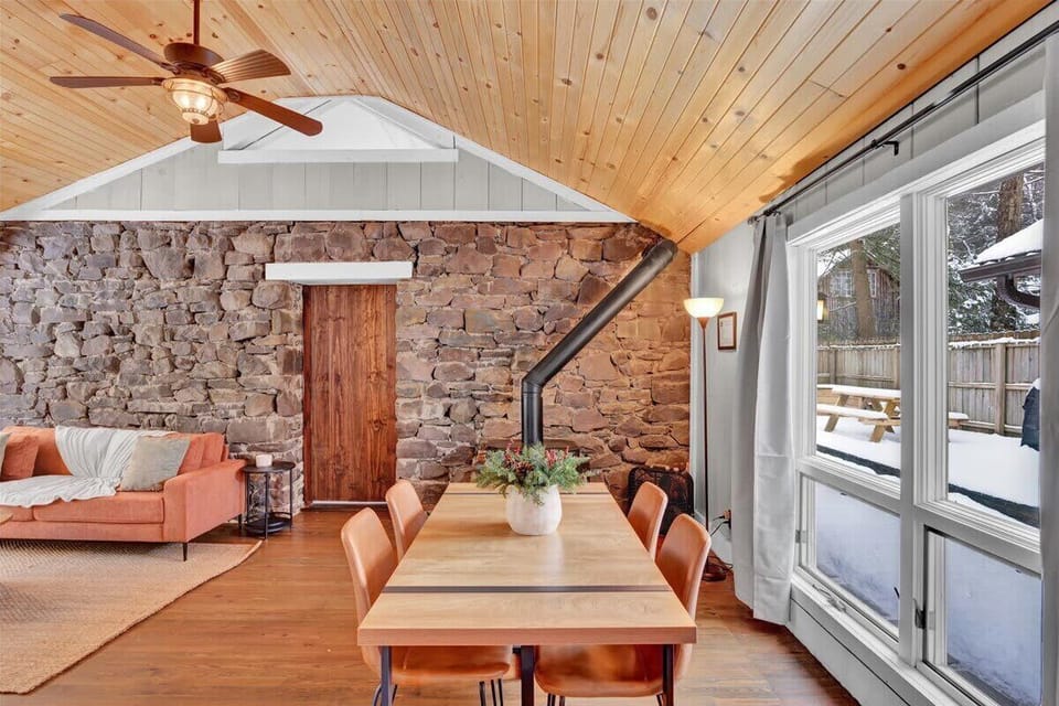 Rustic Farmhouse Dining Area with Wood Ceiling & Natural Light