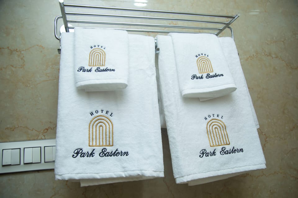Shower, hair dryer, slippers, towels