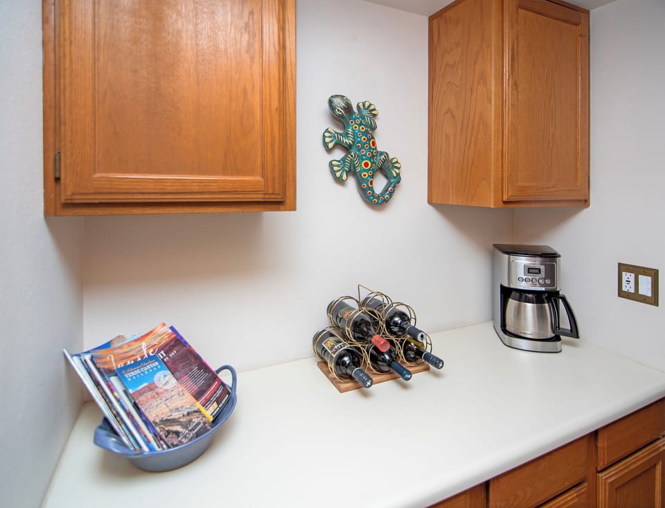 The coffee nook includes a drip coffee maker & coffee supplies