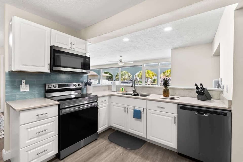 Kitchen with view to pool and living