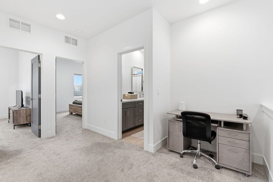 Office desk space and additional rooms - located left of the loft area.