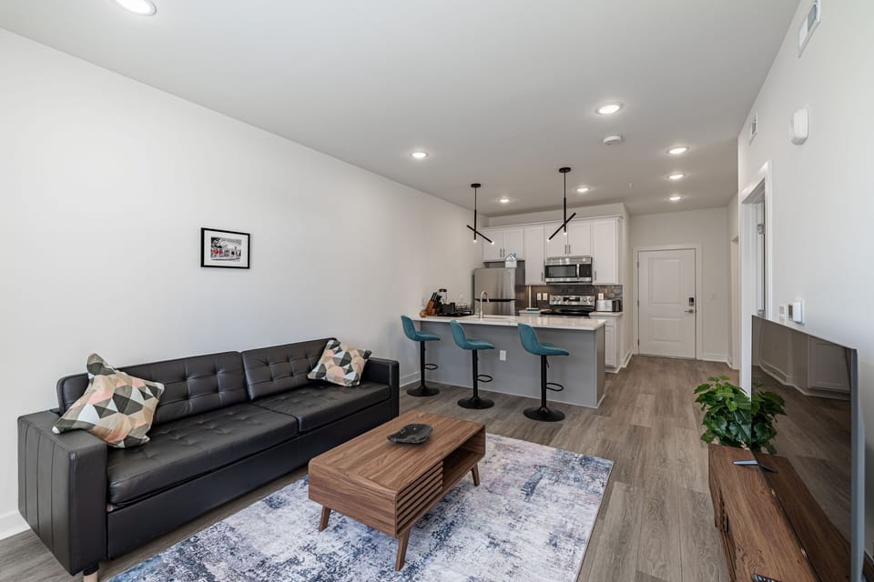 Deluxe Apartment, 1 Queen Bed with Sofa bed, Kitchen, Courtyard View | Living area | 50-inch flat-screen TV with digital channels, streaming services