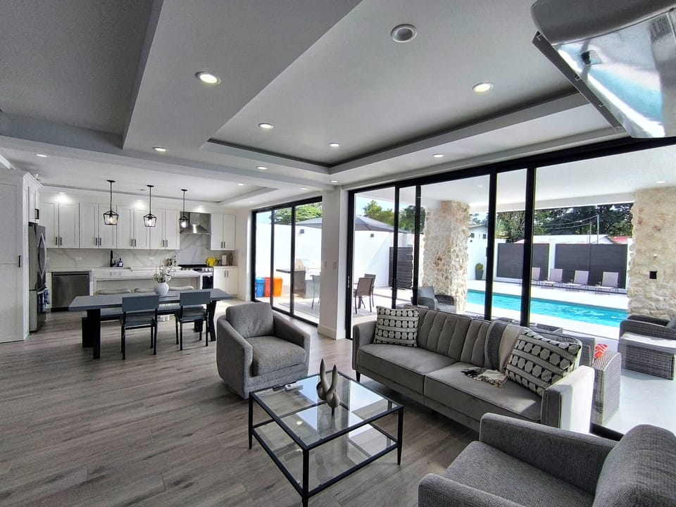 Living room and kitchen area with A/C unit