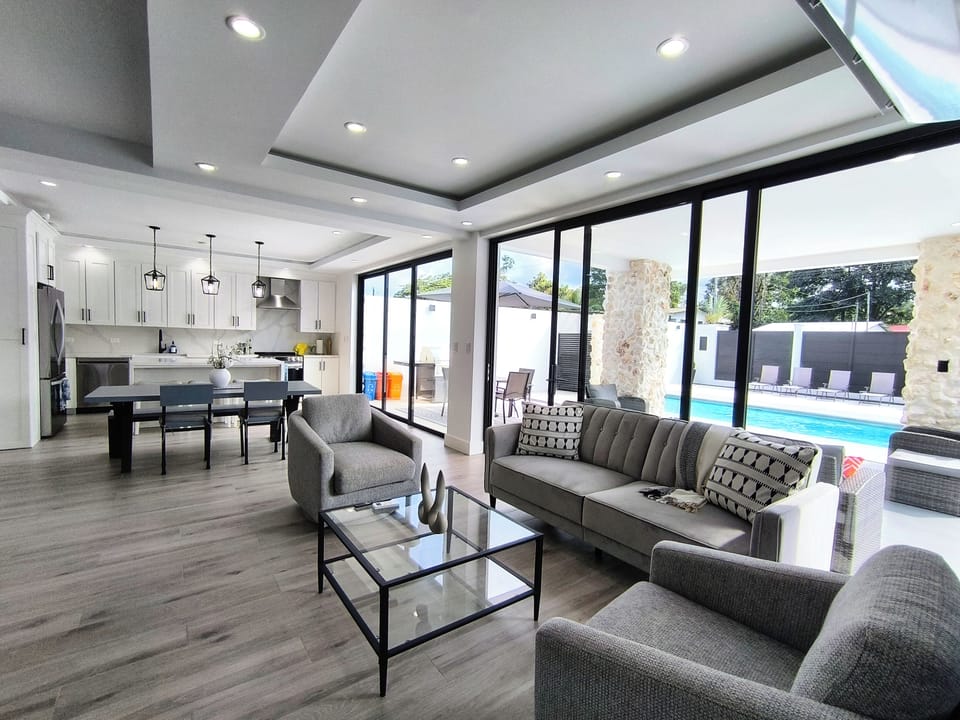 Living room and kitchen area with A/C unit