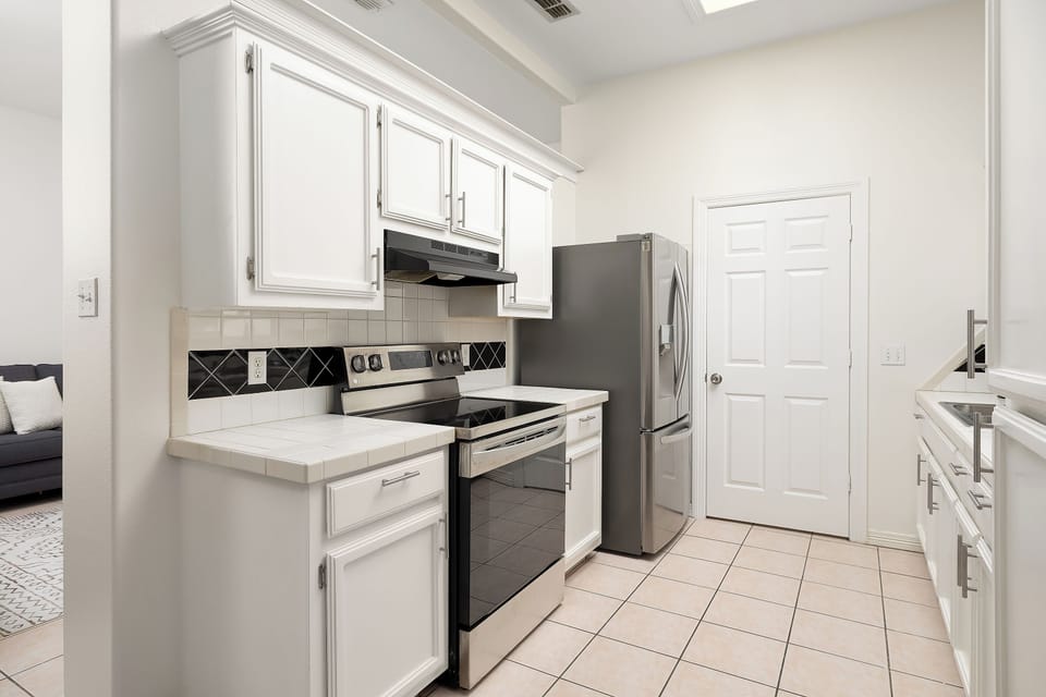 Kitchen with electric kettle, coffee maker and coffee