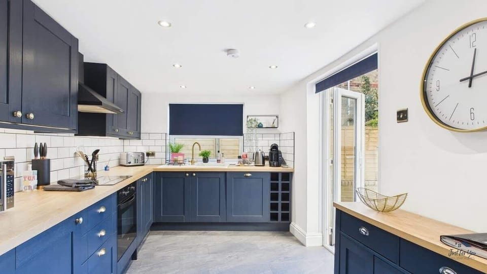 Cook up a feast in the sleek, modern kitchen equipped with an induction hob, oven, and microwave.