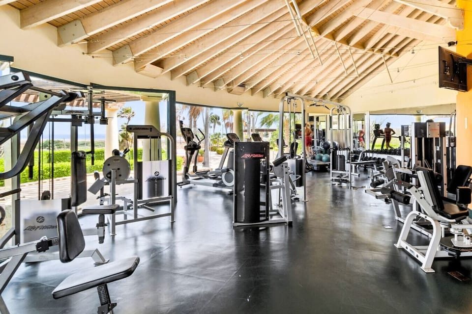 The fitness center boasts modern equipment, open layouts, and floor-to-ceiling windows, offering scenic views for an inspiring workout experience.