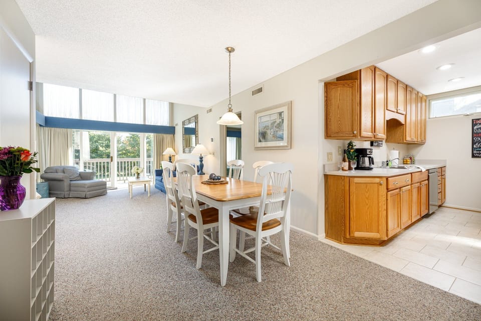 Open dining area flows into the kitchen, perfect for shared meals & easy conversation