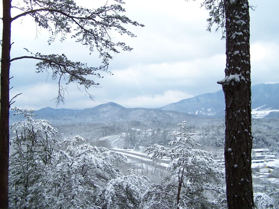 View of the snow covered mountains from the back porch at Laurel Ridge
