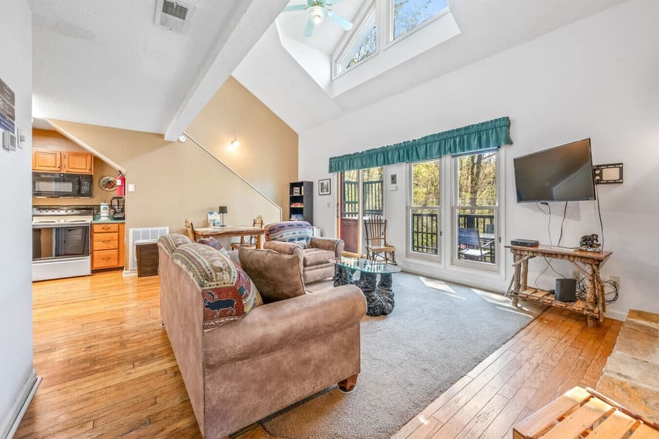 Enter the cabin through the living room. There is lots of natural light throughout the cabin.