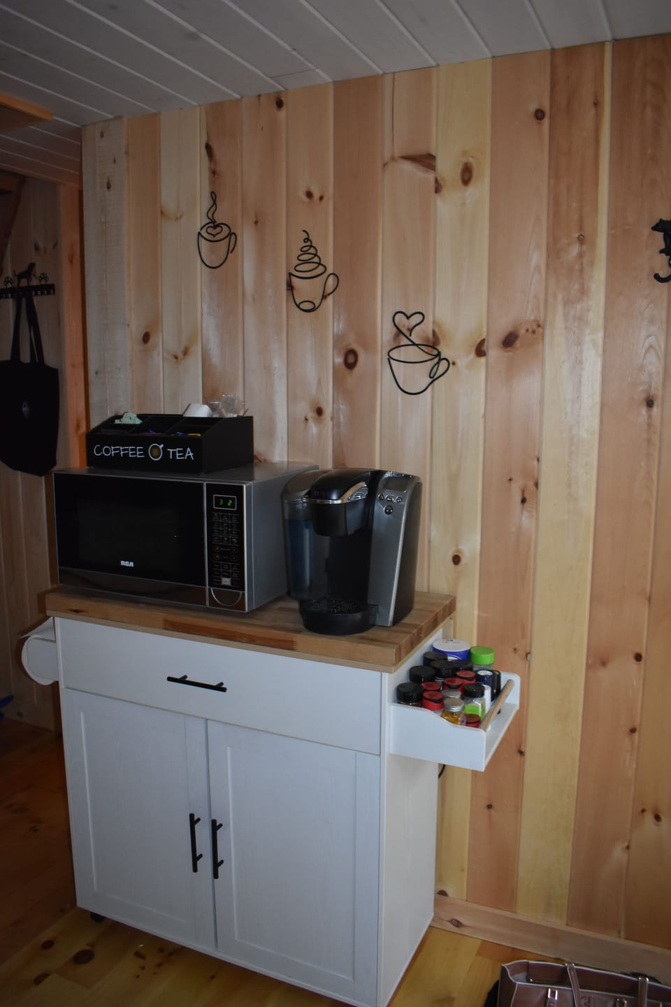 Microwave and coffee station in full kitchen