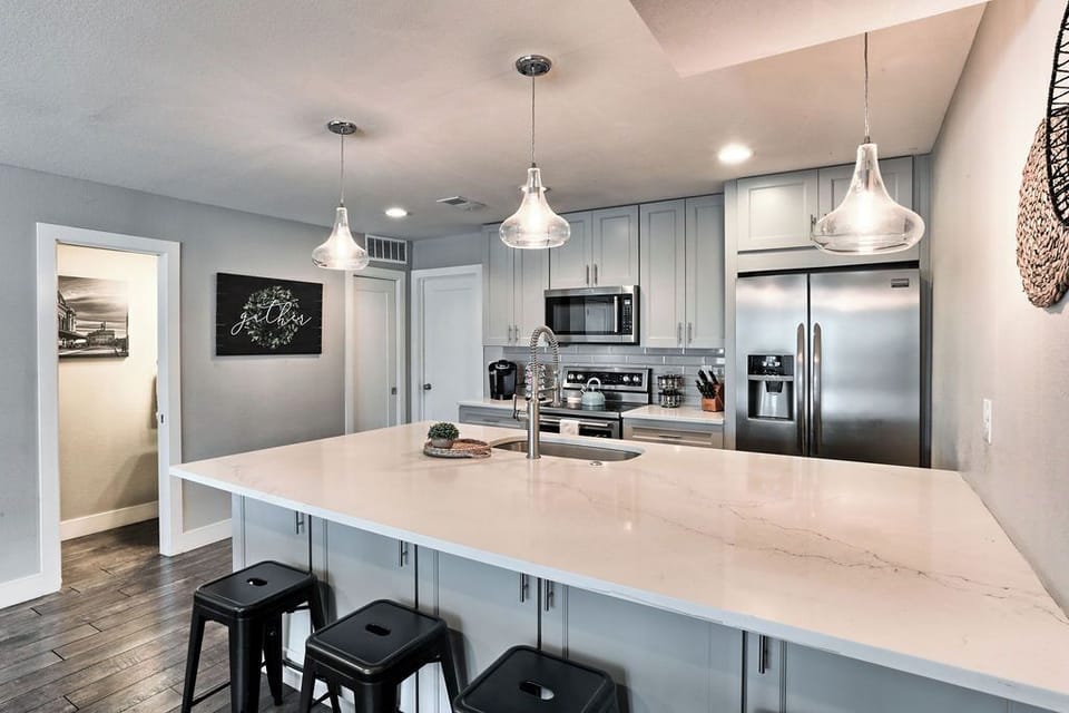 The large kitchen counter is a perfect breakfast nook spot with extra seating