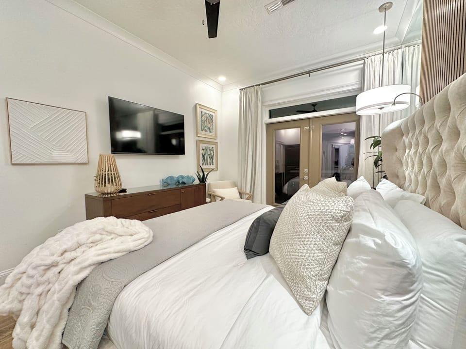 Lower Level King Master has a tv, dresser, & closet system for clothing storage.