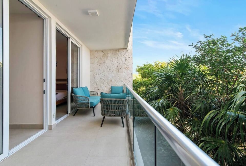 Private balconies with seating, perfect for coffee or ocean breezes.