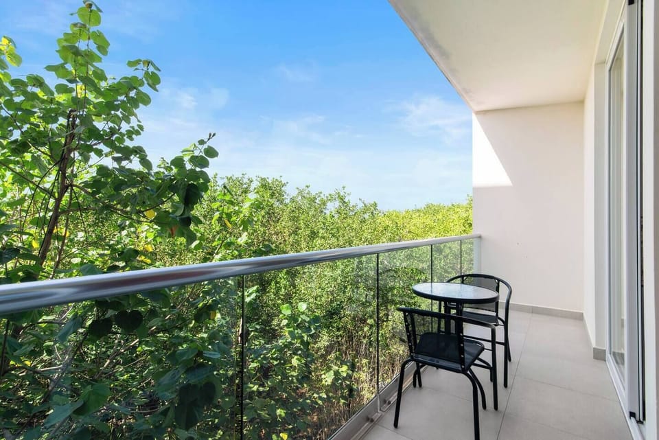 Second balcony with seating, jungle views, and easy access.