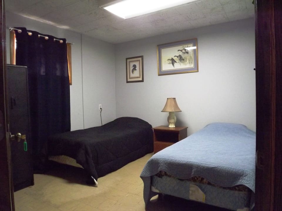 One of six bedrooms, some with two twin beds and others have single twin bed.