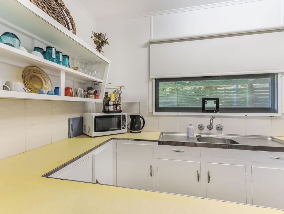 Cozy Pet Friendly Beach House | Private kitchen | Electric kettle, toaster, cleaning supplies, freezer