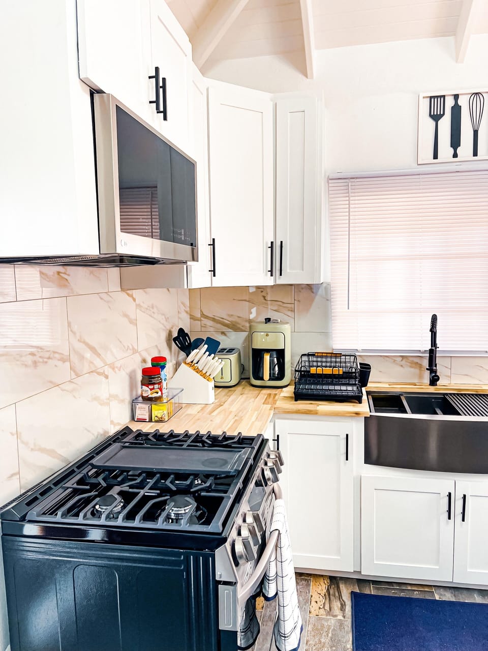 Stainless steel stove and matching microwave.