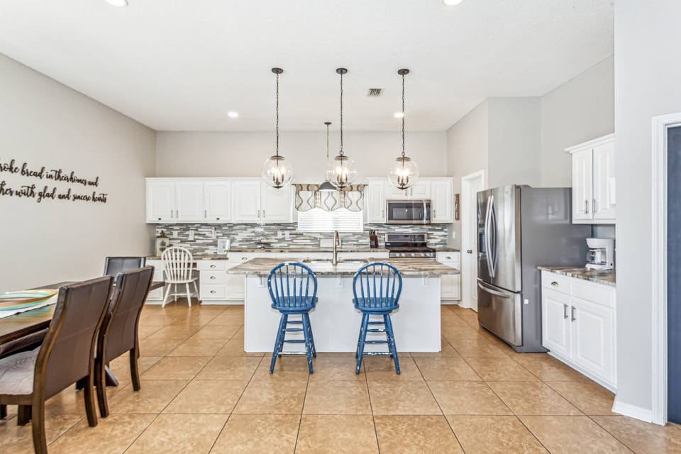Beautifully updated kitchen with oversized island and tile floors