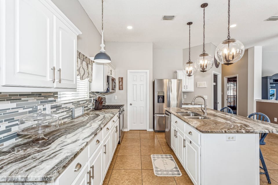 Huge fully equipped kitchen with granite counters