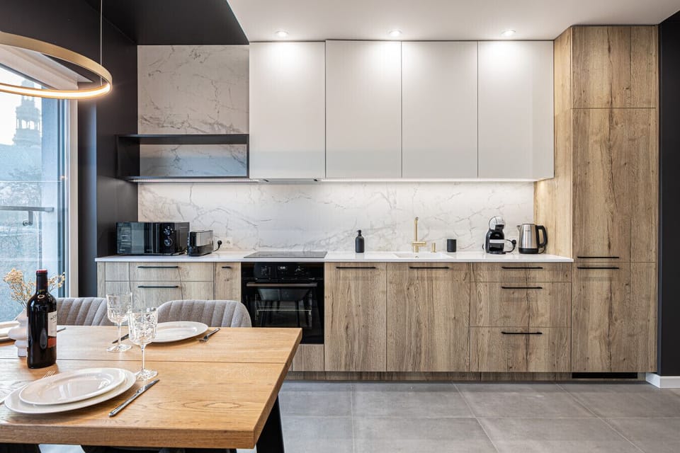 A modern kitchenette with an induction cooktop, perfect for preparing delicious and healthy meals. Functionality and style that inspire culinary creativity!