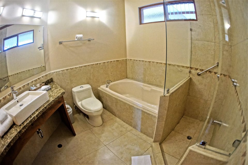 Deluxe Room, 2 Queen Beds | Bathroom | Separate tub and shower, eco-friendly toiletries, hair dryer, towels