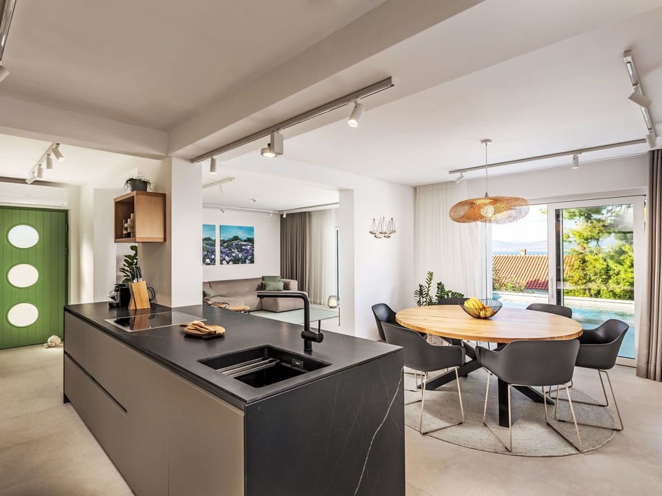 Furniture, Interior Design, Kitchen, Countertop, Flooring, Light Fixture, Floor, Ceiling, Wood, Kitchen & Dining Room Table